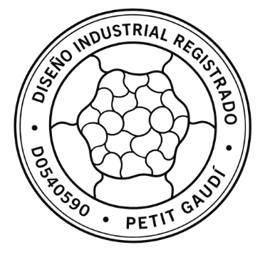 Sello circular de Diseño Industrial Registrado D0540590 con la silueta del puzzle de Petit Gaudí en el centro y texto perimetral en negro.
